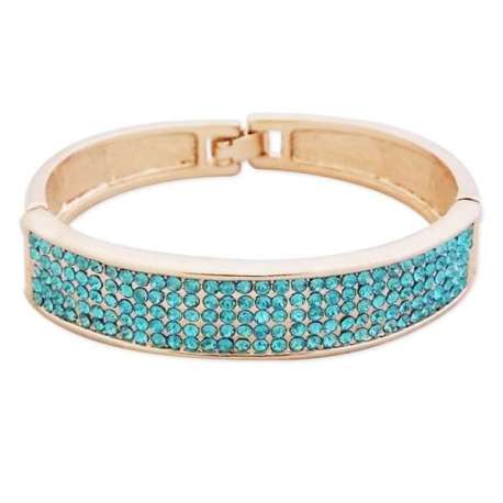 Bracelet doré large avec des strass bleus